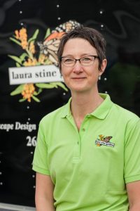 Woman in Laura Stine Gardens shirt in front of trailer