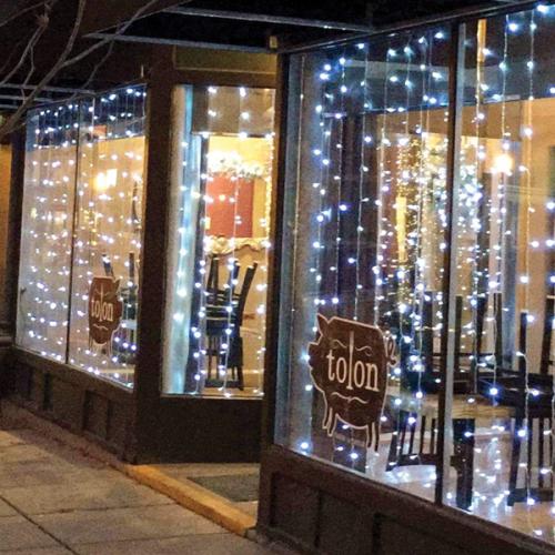 Restaurant storefront with lights