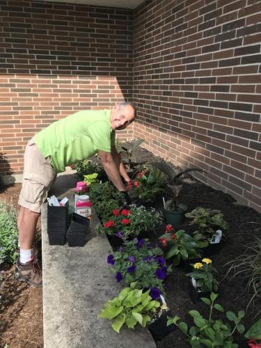 Man planting flowers